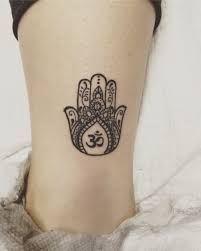 Tattoo History And What They Mean Today Lotusblume Tattoo Tatowierungen Om Tattoo