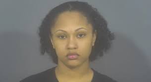 Police say this woman drove around a stopped school bus and almost hit two  students. Take a look at the video below.