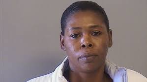 Police find murder suspect already behind bars; girlfriend arrested as an  accessory