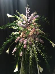 Flowers are one of the most important aspects of a wedding. Calla Lillies And Roses Standing Spray In Lafayette La Flowers Etc
