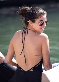 The black and white image depicts praying selena gomez debuts huge upper thigh tattoo of hands praying with a rosary after her comeback performance at american music awards. Love Yourself First Tattoo Bikini Selena Gomez Selena Gomez Tattoo Rib Tattoos For Women Rib Tattoo