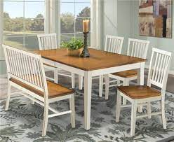 The seat is made from wood with visible wood grain for a rustic look. Dining Room Benches With Backs Front Design