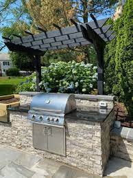 It looks more elegant than a standalone grill. Outdoor Kitchen Designs Installation J J Landscape Management Inc