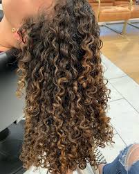 You need very long hair to achieve this look. Golden Highlights On Naturally Curly Hair Dark Hair With Highlights Dark Curly Hair Curly Hair Styles Naturally