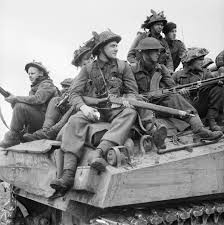 File:British infantry ride on Sherman tanks in Holland, 24 September 1944.  B10287.jpg - Wikimedia Commons