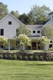 Get inspired to incorporate contemporary twists on the classic style into your home with our roundup of modern farmhouse decor ideas. Hello Lovely Studio Modern Farmhouse Inspiration Farmhouse Exterior Farmhouse Landscaping House Landscape