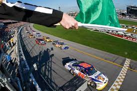 Nascar waves a green flag. The 7 Flags Of Racing Part 1 The Flag Press