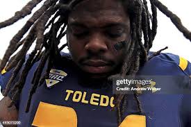 Linebacker Chase Murdock of the Toledo Rockets runs the ball during... News  Photo