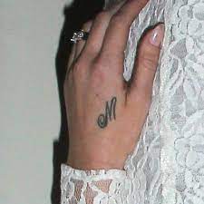 Lana del rey with alternative model, bradley soileau in 'born to die.' many of her fans see her as this modern day goddess straight out of a vintage film with james dean. Lana Del Rey S 6 Tattoos Meanings Steal Her Style