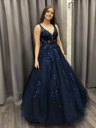 Going for a simple and timeless dress is always a great option, and these beautiful bridalwear pieces will all stand the test of time. V Neck Dark Blue Lace Long Prom Dresses Dark Blue Lace Formal Dresses Shiny Party