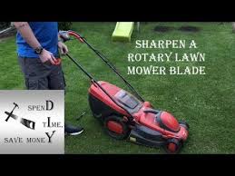 Insert a blade sharpener into a standard drill. How To Sharpen A Rotary Lawn Mower Blade Quick And Easy Youtube