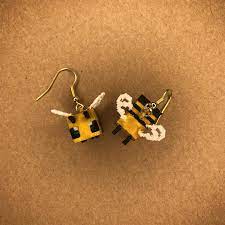 Having a lit campfire or lighting a fire underneath the nest or hive prevents the bees from becoming hostile. Minecraft Bee Earrings Funky Jewelry Weird Jewelry Quirky Earrings