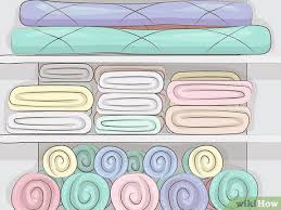 Remove items and wipe down shelves, working from the top down; How To Organize Deep Closet Shelves 11 Steps With Pictures