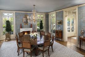 The dining table is more than just a place to eat. Traditional Dining Room Fireplace Round Table The Glam Pad