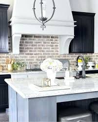 Whitewash Brick Backsplash Brick Black Cabinets Neutral And A Whitewashed Brick Pai Farmhouse Kitchen Backsplash Farmhouse Kitchen Colors Kitchen Remodel Small