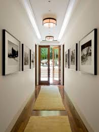Easy Ways To Make Your Hallways Look Bigger Brighter Narrow Hallway Decorating Hallway Designs Hallway Decorating