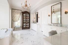 Nine long months later and we have finally completed our bathroom renovation. White Marble Floor In Traditional Master Bathroom With Glass Door Towel Cabinet And Gold Chandelier Hgtv