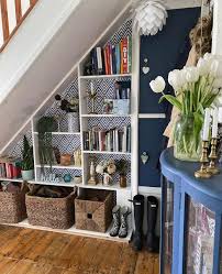 Reading nook or book storage under the stairs build in open shelves for books under the stairs or make a stairs with boxes or drawers inside to place your books and other objects you like. 10 Ingenious Storage Ideas For Under The Stairs Melanie Jade Design
