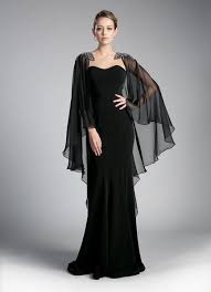 Be Stunning In This Long Black Cape Dress By Cinderella Divine 11435 This Evening Gown Features A Beauti Black Evening Gown Cape Dress Long Black Dress Outfit