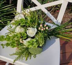 Hand Tied Bouquet Featuring Roses Lotus Pods Bells Of Ireland Soldiago And Hypericum Lotus Pods Hand Tied Bouquet Floral Wreath