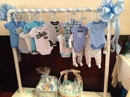 Save money by discovering these easy to make diy baby clothes such as leather shoes, dresses, onesies, hats, slippers, leggings and much more. Clothing Rack Clothingrack Babyboy Babyshower Diy Baby Shower Clothes Pin Baby Shower Clothes Baby Shower Clothes Pin Game