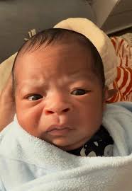 A newborn baby is going viral for his grumpy facial expressions