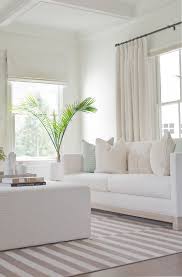 Light And Bright Living Room White Sofas Striped Area Rug White Coffered Ceiling In The Livin White Sofa Living Room Living Room White Luxury Living Room