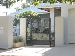 Modern iron fence design with fancy and wonderful modern house design with variegated cedar wraps and cool natural stone fence. Modern Houses Gates Design Design For Home