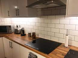 There's no denying that wooden worktops are a versatile choice, ideal for both traditional and contemporary kitchens. White Tiles And Grey Grout White Kitchen Tiles White Kitchen Tiles Grey Grout White Gloss Kitchen