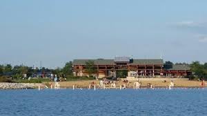 A seating area with tables and an overhead pergola for parents to rest and watch their children at play while having some shade is immediately adjacent to the playground. Stand Up Paddle Board Rentals Picture Of Three Oaks Recreation Area Crystal Lake Tripadvisor