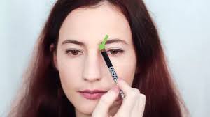 Dip a thin nose contour brush (or any small contour brush) into a color that's one to two shades darker than your skin tone and paint a line on either side of your nose. 4 Ways To Contour Your Nose Wikihow
