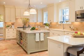 white kitchen with painted green island