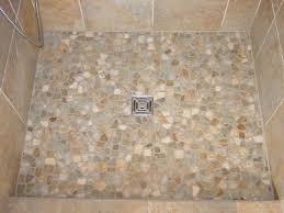 Pebble Shower Floors For Tiled Showers How To Install Small Rocks Tile Your World Shower Tile Shower Floor Pebble Tile Shower Floor