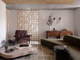 It is designed to nest with the end table. The Super Low Coffee Table Is In Again Architectural Digest