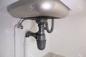 water drain pipe under kitchen sink and