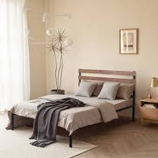 A custom bed frame made of bleached oak, designed by terri robison, is the centerpiece in this bedroom. Bed Frames Mattress Foundations Target