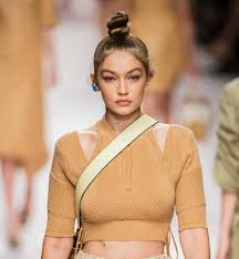 A bun is a type of hairstyle in which the hair is pulled back from the face, twisted or plaited, and wrapped in a circular coil around itself, typically on top or back of the head or just above the neck. 6 Sleek Buns To Banish Bad Hair Days The Fashion Spot
