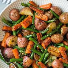 Garlic Herb Roasted Potatoes Carrots And Green Beans Recipe Yummly Recipe Herb Roasted Potatoes Green Bean Recipes Carrots And Green Beans