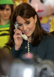 Kate Middleton swaps her tiara for a City suit to join SamCam for ICAP's  Charity Day