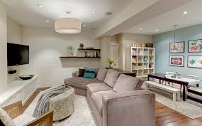 Matching floor lamps cast overlapping circles of light on the bed, providing view image. Low Basement Ceilings Houzz
