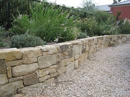 Dry Stacked With Gravel In Front Natural Stone Retaining Wall Landscape Design Stone Retaining Wall