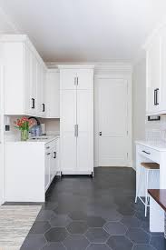 Maybe you would like to learn more about one of these? White Laundry Room Cabinets With Large Black Hexagon Floor Tiles Transitional Laundry Room