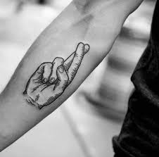 So, what makes these designs popular with in the industry? 50 Fingers Crossed Tattoo Designs For Men Hand Gesture Ink Ideas
