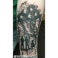 Black And Grey American Flag Tattoo Sleeve Awesome Black And Grey American Flag With Soldier Silhouettes And Lettering Forearm Tattoo By A Military Tattoos Memorial Tattoo Sleeves American Flag Tattoo
