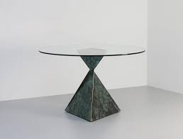 This round coffee table owns an aluminium frame and is accented with durable synthetic woven rattan. Tom Faulkner Modern Contemporary Handmade Furniture