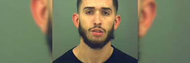 Driver arrested after striking pedestrian, electric pole in rollover crash