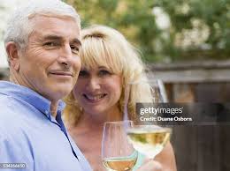 Couple With Glasses Of Wine High-Res Stock Photo