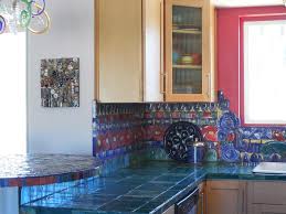 Cabinets, tile countertops, blue backsplash, paneled appliances, an island, ceramic. Colorful Kitchen With Handmade Ceramic Tile Countertops Hgtv