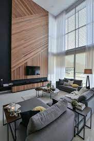 Kitchen and living room all open to each other. Wil S 11 Residence Living Room With A Double Volume Wood Wall Feature Matched With Sheer Curta High Ceiling Living Room Contemporary Living Room Living Design