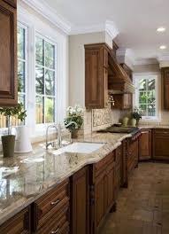 Dark Cabinets Light Counter Tops Medium Floor With Champaign Walls And White Windows Kitchen Renovation Brown Kitchen Cabinets Kitchen Remodel